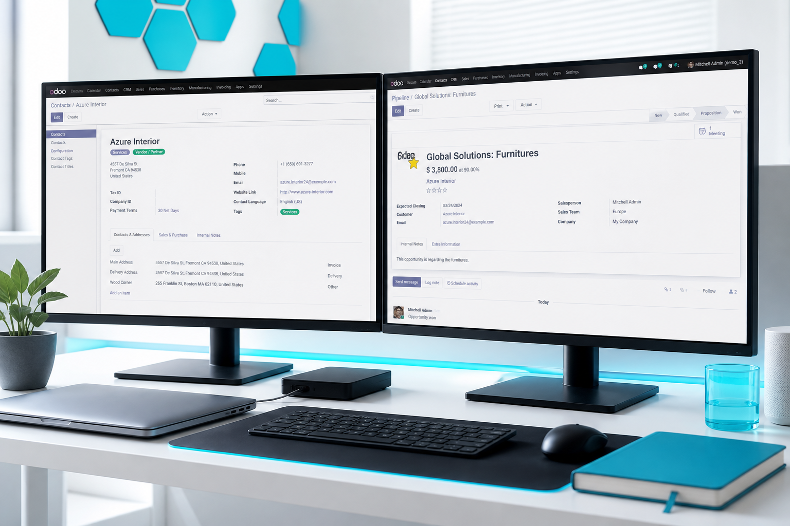 Bright implementation workspace with dual screens showing Odoo ERP workflows